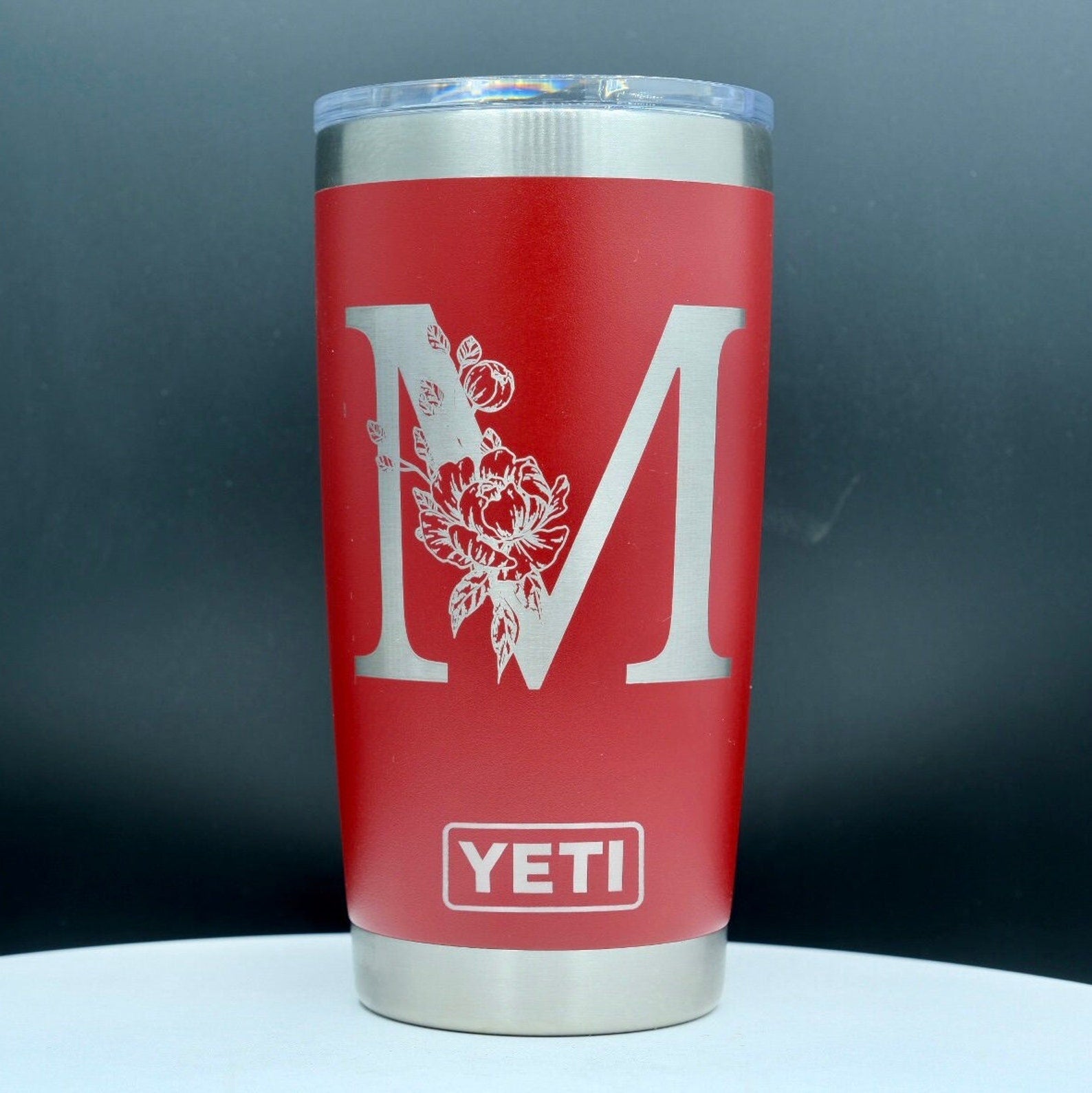 Single letter floral monogram laser or hand engraved on a 20oz Yeti tumbler. Dishwasher safe.... These are NOT sticker’s or vinyl decals!