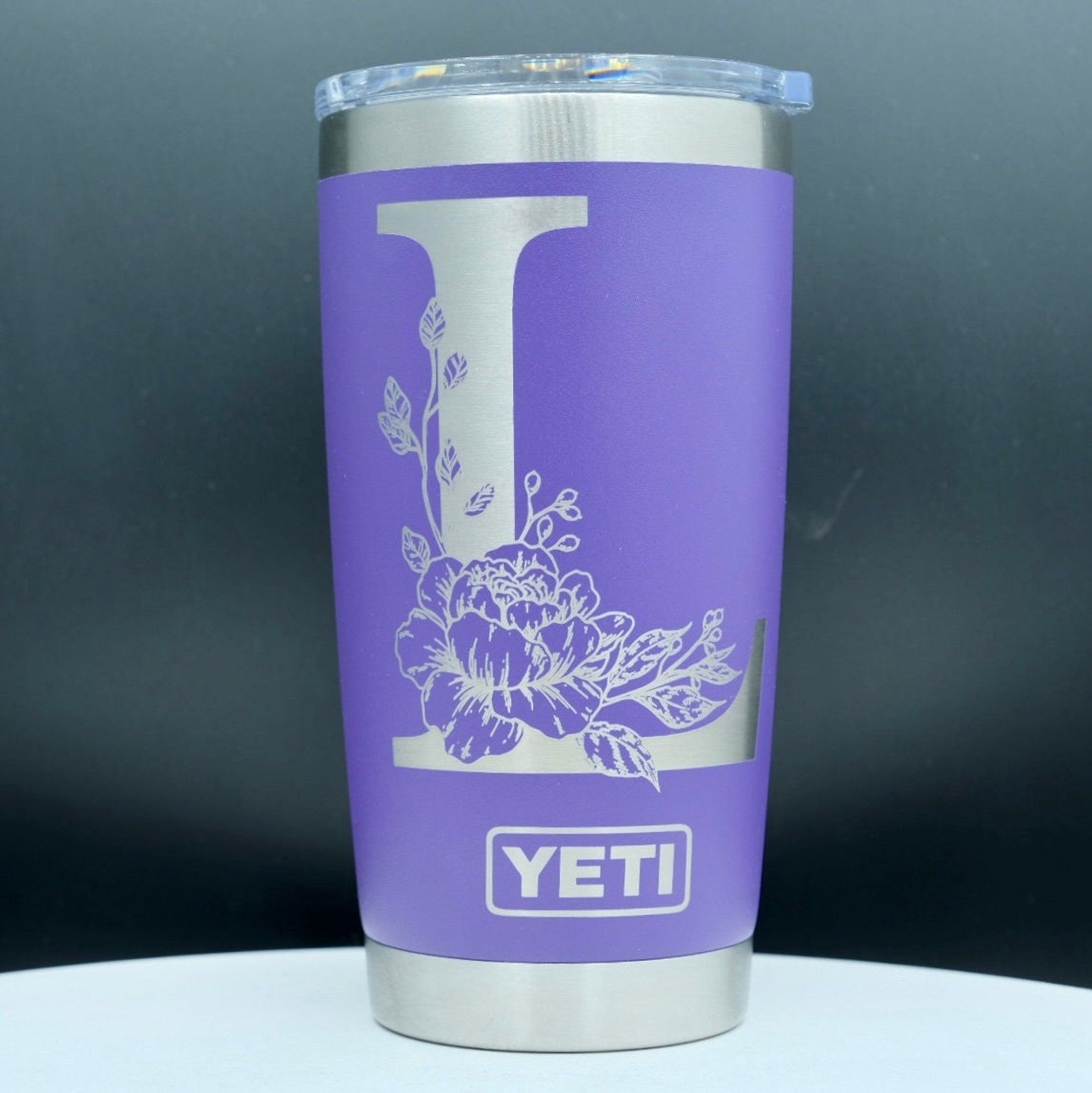 Single letter floral monogram laser or hand engraved on a 20oz Yeti tumbler. Dishwasher safe.... These are NOT sticker’s or vinyl decals!