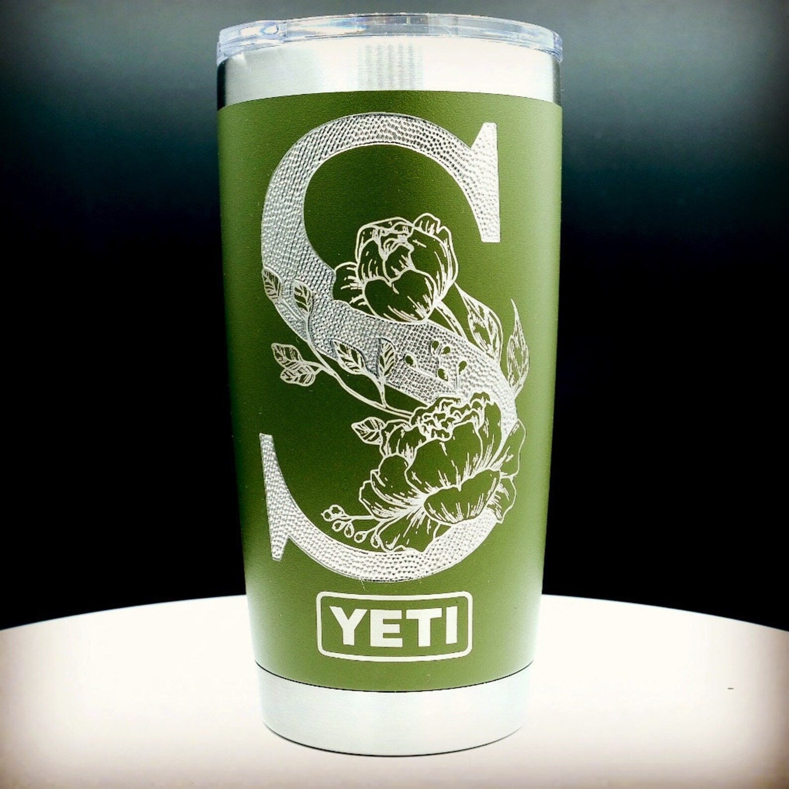Single letter floral monogram laser or hand engraved on a 20oz Yeti tumbler. Dishwasher safe.... These are NOT sticker’s or vinyl decals!