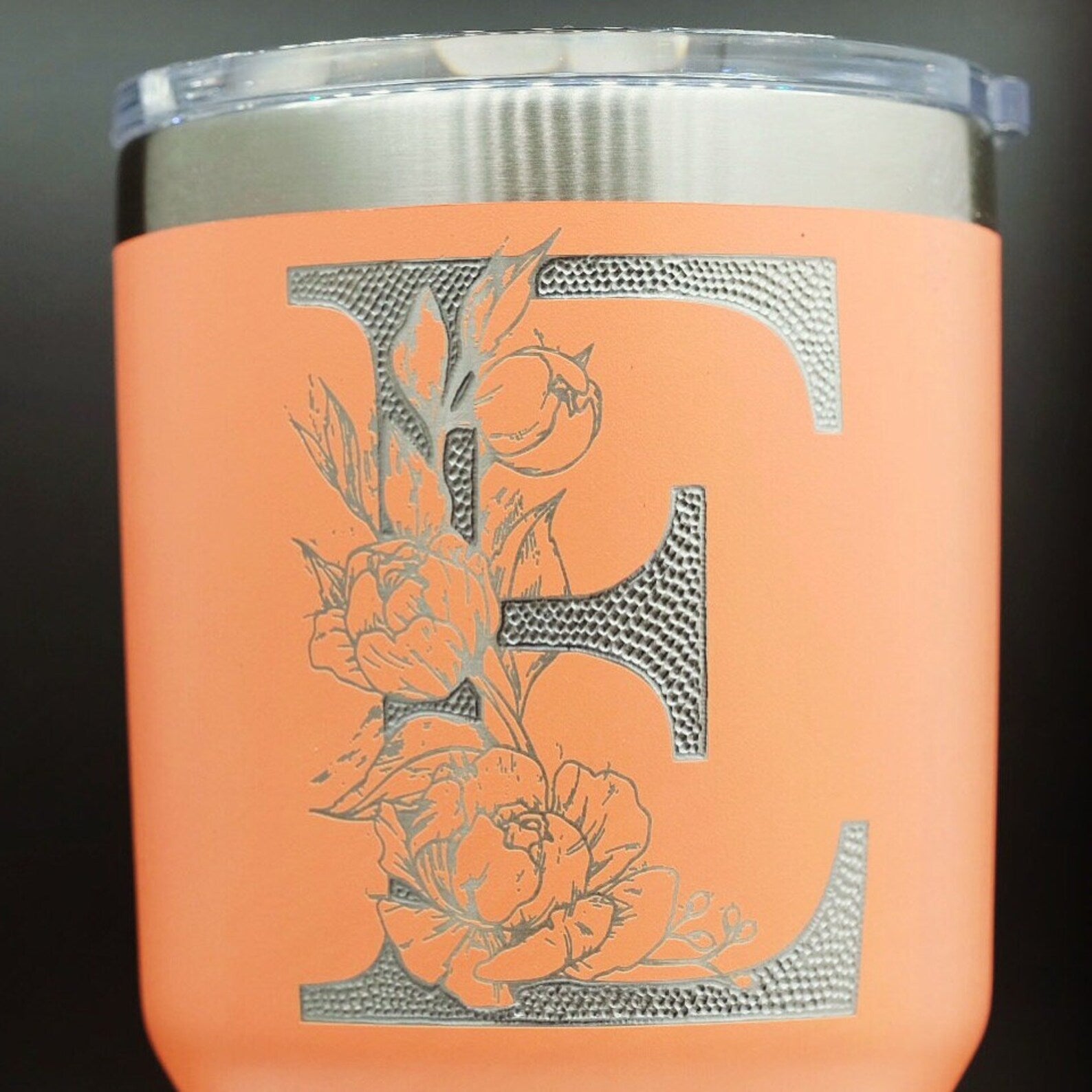 Single letter floral monogram laser or hand engraved on a 20oz Yeti tumbler. Dishwasher safe.... These are NOT sticker’s or vinyl decals!